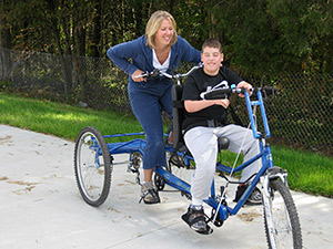 Mom and son on bike