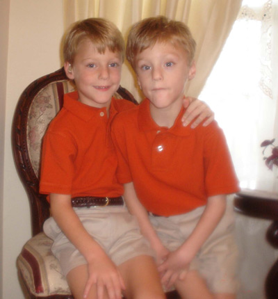 2 boys in matching outfits