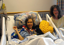 Girl in hospital bed with friend